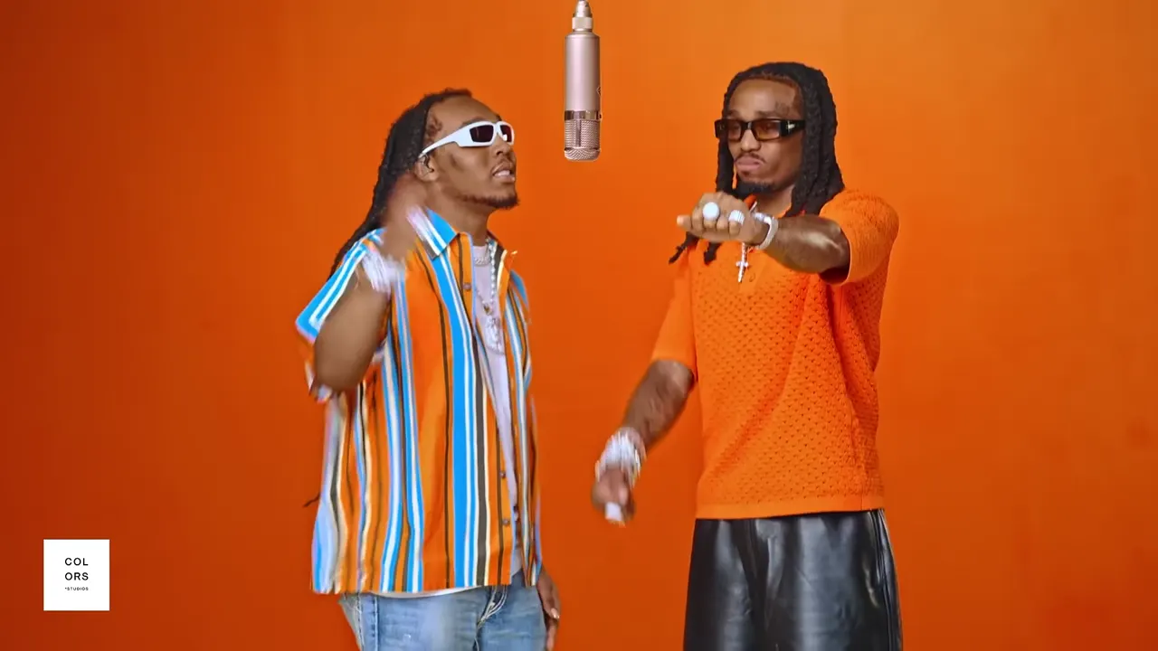 Hotel Lobby AI template: two performers in the orange COLORS booth with a hanging microphone